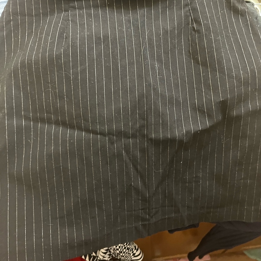 Back skirt with silver sparkly stripes on it zipper in the back of it